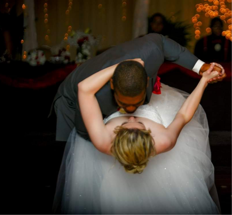 a groom dancing with his bride